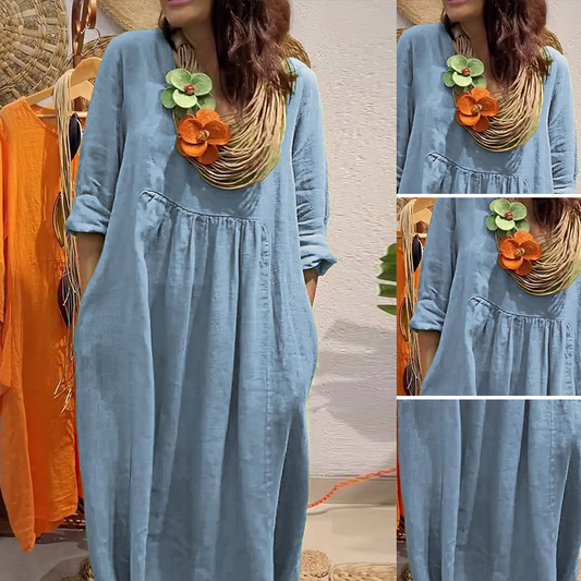 Löst sittande enfärgat bomulls- och linneklänning med V-ringning och fickor