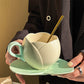 Keramisk kaffekopp med fat