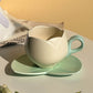 Keramisk kaffekopp med fat