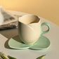 Keramisk kaffekopp med fat