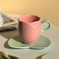 Keramisk kaffekopp med fat