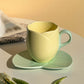 Keramisk kaffekopp med fat